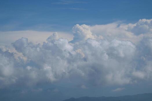 High nature view large white clouds on soft sky background in the morning, View of white cloudy on the plane. photo