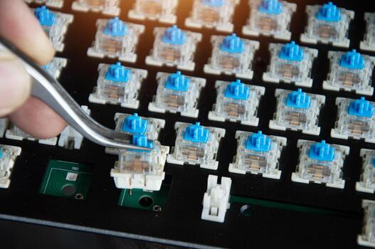 Top view of the replaceable keyboard keycap Keyboard repair technician. photo