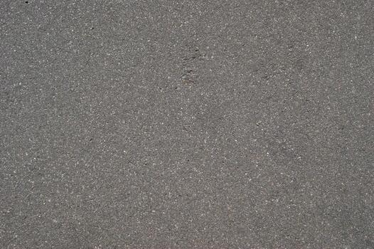 Fine gray sand texture with smooth, even surface and small granular particles photo