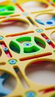 Colorful plastic gears and frames from a children's construction toy set. Bright, close-up image perfect for themes of play, education, and creativity. video