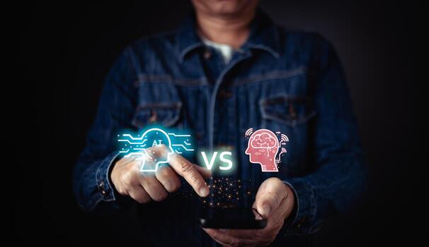 A person holds a smartphone displaying a visual comparison between AI and human intelligence, symbolizing a debate on technology versus human capability. photo