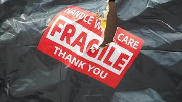 a package marked with warnings fragile arrived damage, video