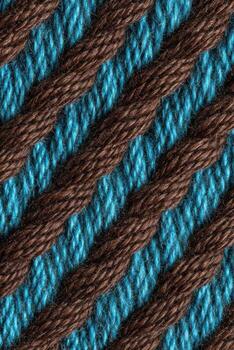 Woven fabric texture featuring turquoise and brown threads, showcasing intricate patterns and rich colors, ideal for textile design and creative projects with copy space photo