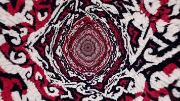 spirale astratto modello con vivace rosso, Nero, e bianca colori, la creazione di un' ipnotizzante tunnel effetto, illustrare continuo movimento e profondità nel visivo design video