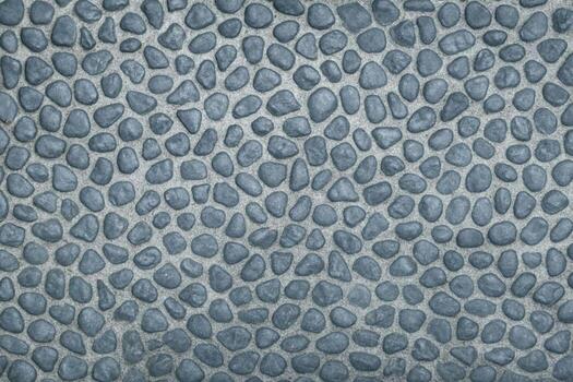 Blue Gray Pebble Surface With Evenly Sized Rounded Stones Creating Consistent Textured Field photo
