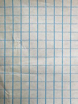 Macro texture of blue grid pattern on squared graph paper photo