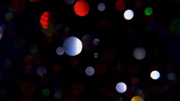 raggiante e colorato particelle nel movimento su un' nero sfondo, copertura influenzare con scintille video
