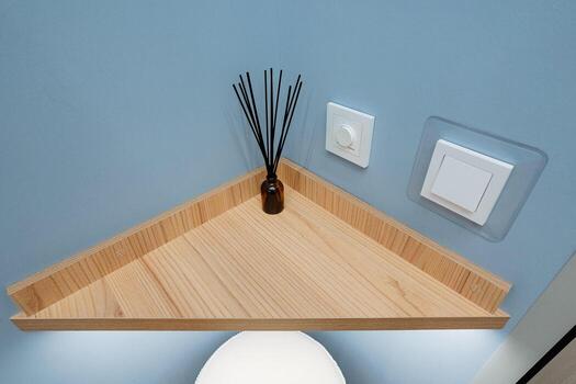 Introducing the Modern Corner Shelf that comes equipped with both a diffuser and a convenient light switch, perfect for enhancing your interior spaces ambiance and providing soothing aromatherapy photo