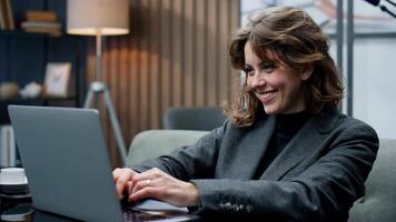 Happy, remote work and woman with a laptop for call center communication and consultation. Smile, virtual assistant and a customer service agent typing on a computer from a house for telemarketing video