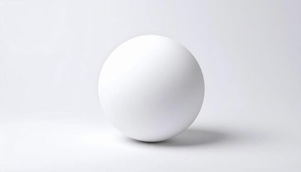 A perfectly smooth white sphere on a white surface with a slight shadow, photo