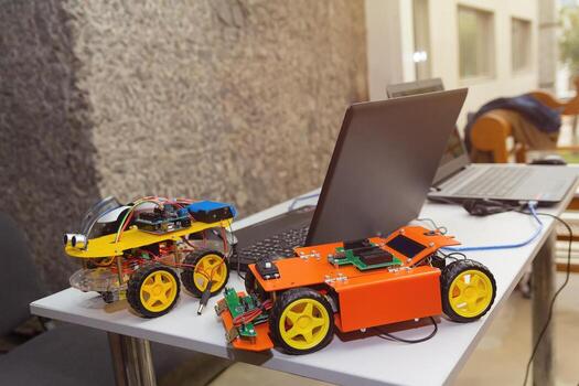Kit models and laptops on the table on robotics photo