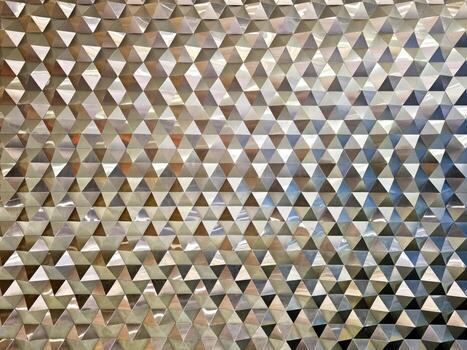 Reflective Geometric Triangle Pattern Wall Texture or Modern Metallic Triangular Facade Background. photo
