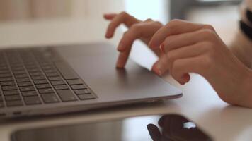 This image shows hands typing on a stylish laptop in a bright, modern workspace, emphasizing productivity and creativity, and encouraging innovative thinking in a digital environment video