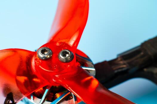 A close-up of a self-assembled drone propeller mounted on a carbon fiber frame with exposed electronics. DIY assembly of unmanned aerial vehicles for a wide range of applications. photo