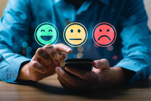 Customer satisfaction feedback concept showing person using mobile phone to select emotion face rating with happy, neutral, sad smiley icons representing service review and user experience evaluatio photo