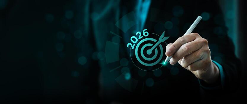 2026 negocio objetivo y objetivo estrategia concepto con empresario utilizando digital bolígrafo a realce diana icono, simbolizando planificación, visión, precisión, y logro de futuro objetivos foto