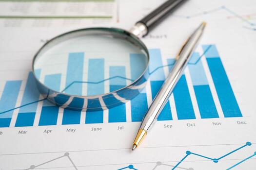 Magnifying on charts graphs paper. Financial development, Banking Account, Statistic, Investment Analytic data photo