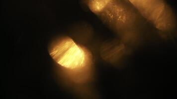 Golden bokeh lights shimmer and glow creating a warm, magical atmosphere for festive backgrounds video