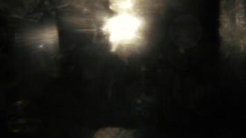 Mysterious ethereal light flares and bokeh create a dreamy, abstract background for creative design. video