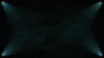 Rotation of the smoke veils under the lights on a black background. Spotlights corner animation with smoke background blue color video