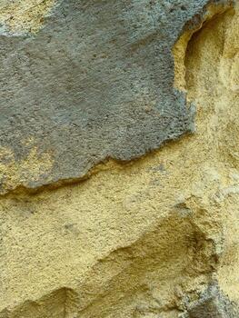 This image showcases textured rock surfaces with abstract patterns in natural colors, highlighting geologys essence and capturing earthy tones and mineral diversity for creative projects photo