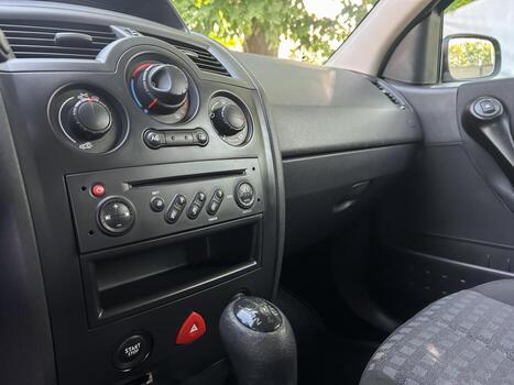 This is an interior view of a modern automobile featuring a stylish dashboard that includes various controls and a gear shift, emphasizing comfort and luxury while enhancing the driving experience photo