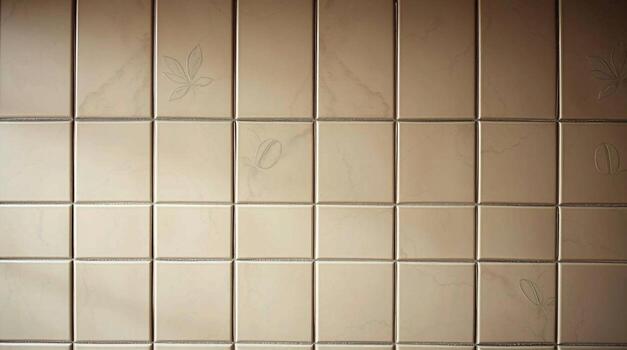 A close up view of a beige tiled wall with a grid pattern and subtle shadows creating depth and texture photo