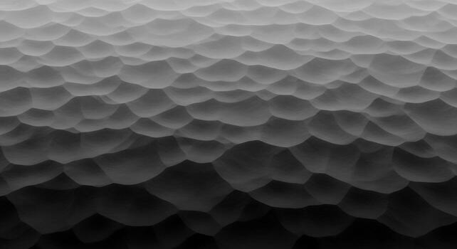 Close up microscopic view of a textured surface with a gradient of light and shadow creating depth and form photo