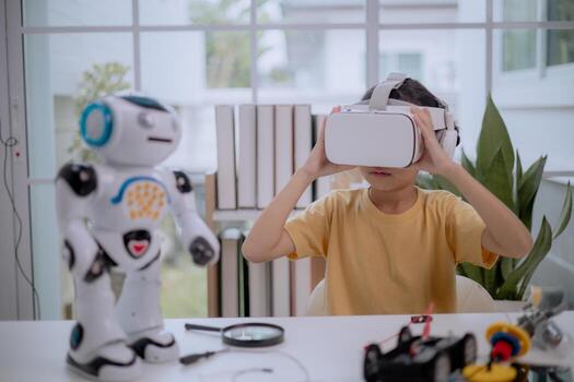 Asian girl using VR headset with robot toy on desk, learning STEM education and virtual reality. Concept of child creativity, robotics, digital learning, AI innovation and immersive future technology. photo