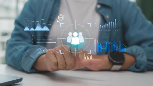 Hand pointing at digital interface with target icon and data analytics graphs, representing customer targeting, data-driven strategy, and business intelligence technology. photo