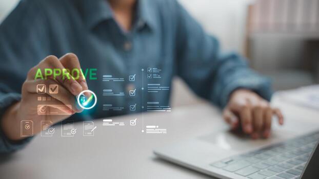 Hand selecting digital approval check mark with checklist and document icons on screen. Concept for business process, workflow management, authorization, and online document approval. photo