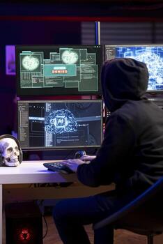 Hacker seeing access denied message on PC monitors while trying to breach company systems. Rogue programmer getting rejected when trying to infiltrate enterprise networks, failing to crack password photo