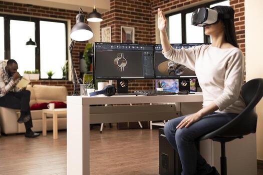 Female developer using VR headset and making hand gestures while designing clamp with CAD software. Immersive virtual reality enhances precision in computer aided design and product development. photo