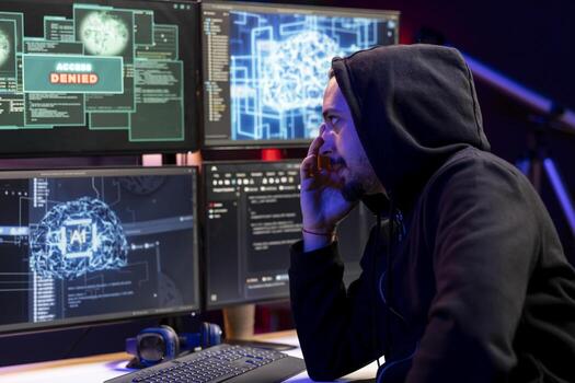 Hacker sad after seeing access denied popup on PC, trying to breach company systems using deep learning. Rogue engineer frowns, getting rejected when trying to infiltrate enterprise networks using AI photo
