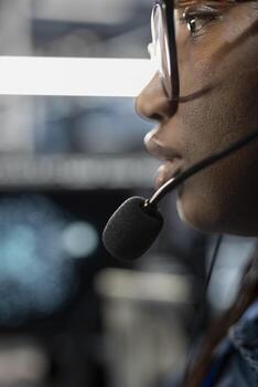 Close up of admin in data center providing technical support to customers, troubleshooting issues. High tech server hub employee carrying out operational technical interventions requested by clients photo
