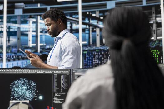 Data center technician deploys AI visualization tool to forecast infrastructure demands and optimize resource allocation. Server farm specialist uses artificial intelligence for predictive maintenance photo