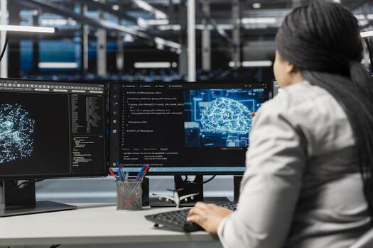 System administrator inspecting neural network data center used for machine learning. Woman at work doing maintenance on server farm to optimize it for artificial intelligence workloads photo