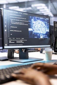 Technician in server room using artificial intelligence technology on computer for increased productivity. Close up shot of data center employee working on PC to implement AI driven solutions photo