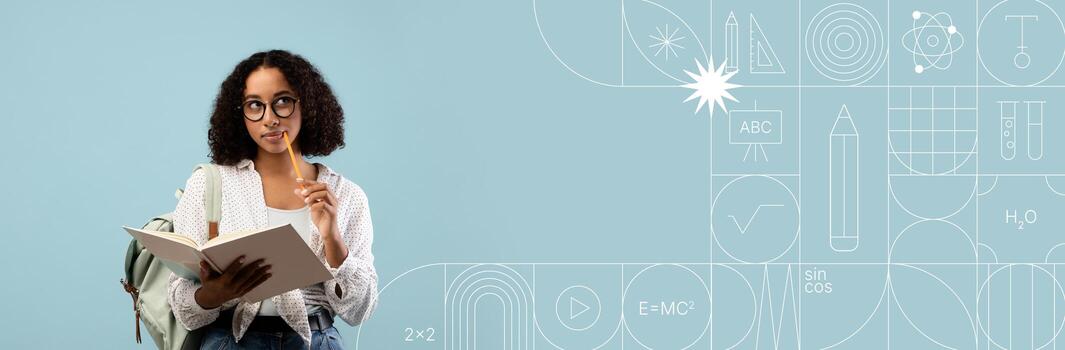 A student is deep in thought while studying with a notebook in one hand and touching her chin with the other. photo
