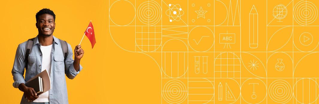 A joyful student holds a flag while standing with books in front of a colorful painted background. The vibrant scene captures the enthusiasm for learning and cultural pride. photo