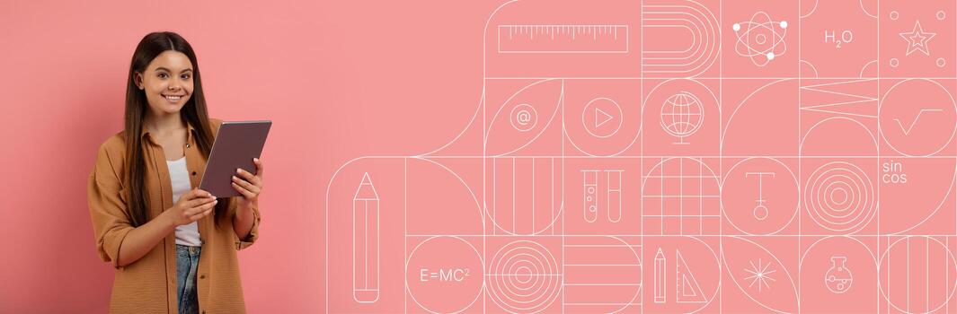 A student stands with a tablet, smiling as she studies in a vibrant environment. The painted background features educational icons, creating an inspiring atmosphere for learning. photo