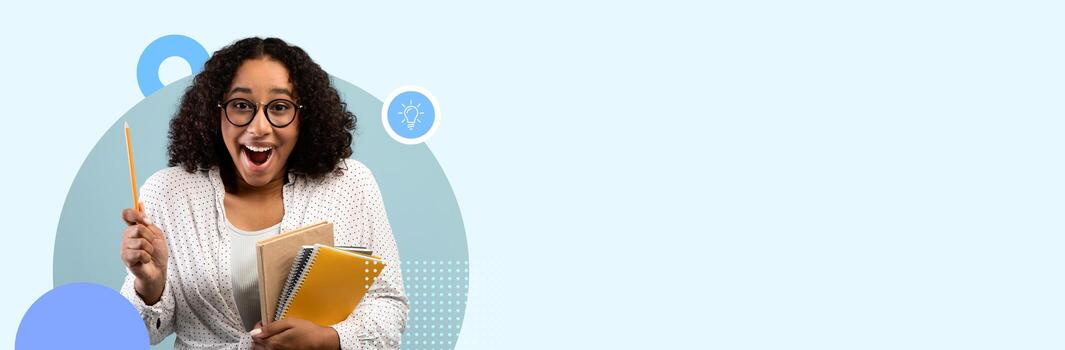 A student stands smiling while holding notebooks and a pencil, showcasing enthusiasm for learning in a bright modern school setting with a spacious background. photo