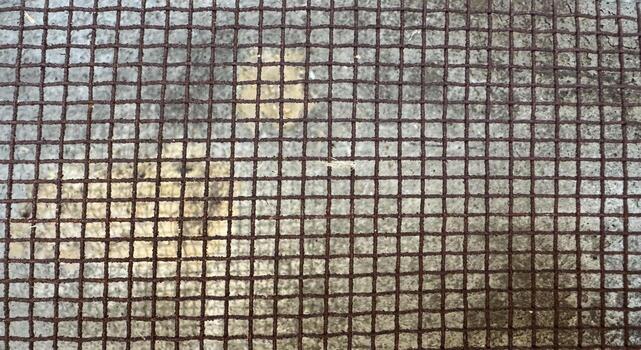 Rustic metal grid texture with square wire mesh pattern photo