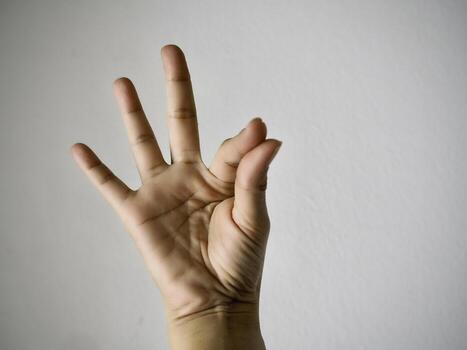 sign language.wmake shape by hand for communicated with deaf person.sign and symbol for counting numbers. photo