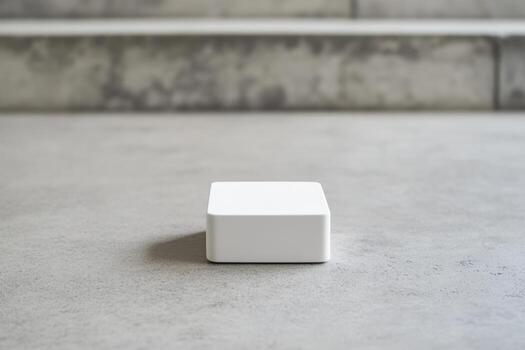 Minimalist white object on a smooth gray surface photo