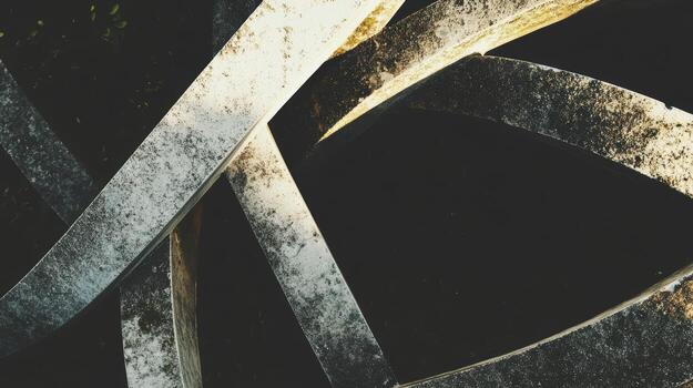 Twisted metal sculptures intertwining in a dark background photo