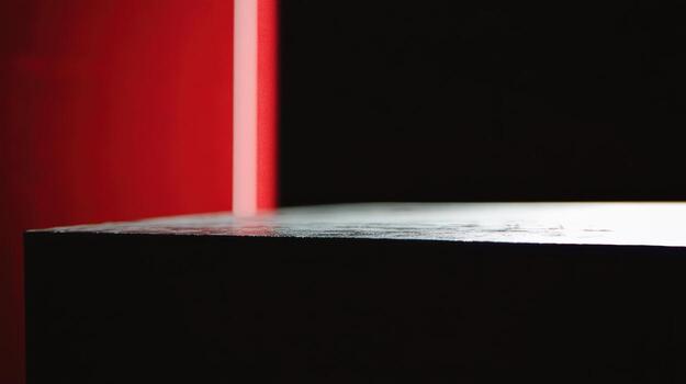 Play of light on a dark surface with red accents photo