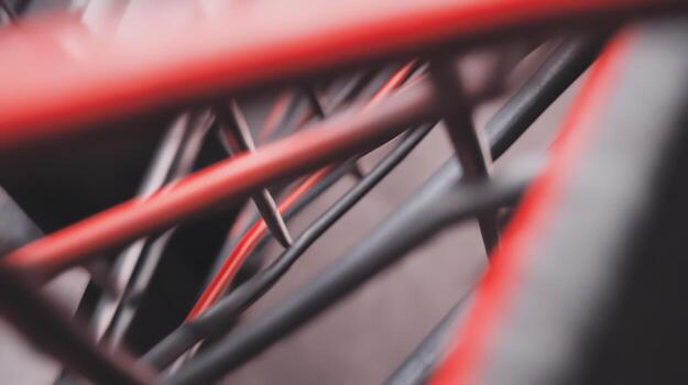 Close-up view of red and black abstract metal shapes photo