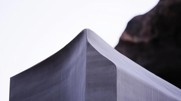 Modern sculpture shaped with smooth lines under sunlight photo