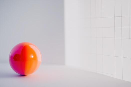 Bright orange sphere on a simple background in soft light photo
